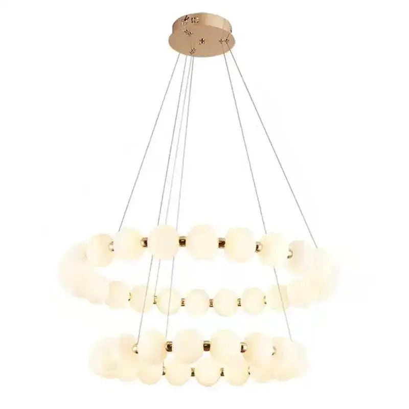Modern brass led pendant light with frosted glass spheres and gold-toned accents for living room decorbites brass led pendant