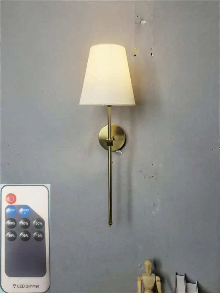 Brass-finished led wall sconce with cream fabric shade for bedroom decorbites led wall lighting solution