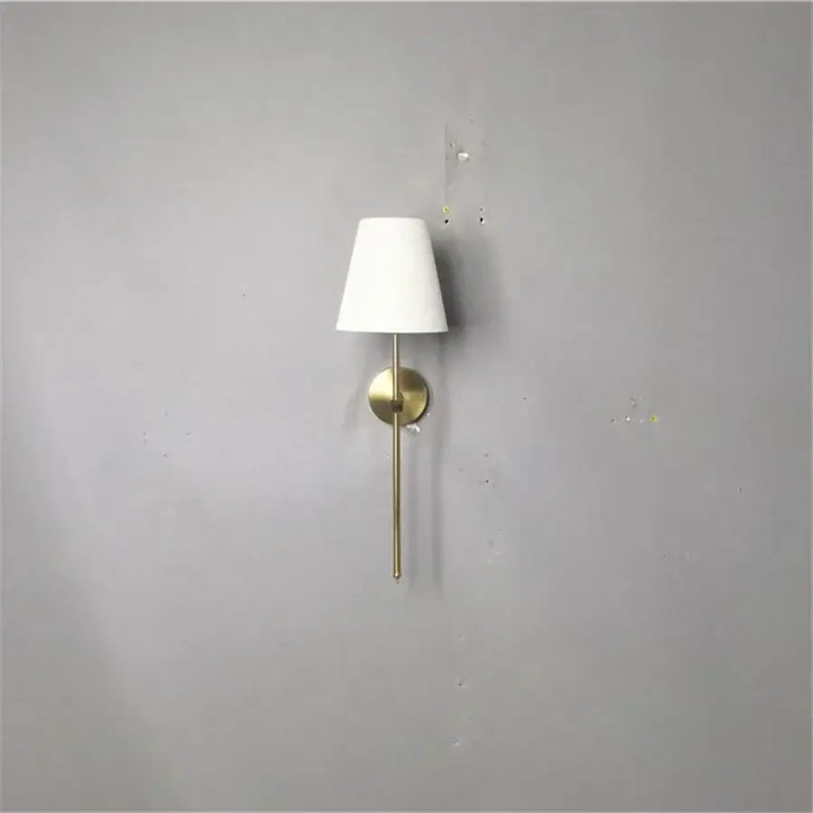 Minimalist modern brass led wall sconce with white fabric shade for bedroom decorbites led wall lighting solution