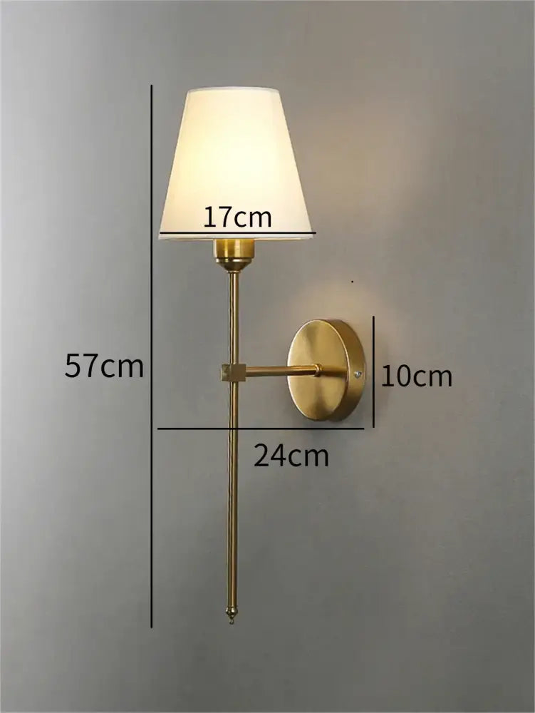 Modern brass led wall sconce with gold-toned finish and cream fabric shade ideal for bedroom decorbites led wall lighting