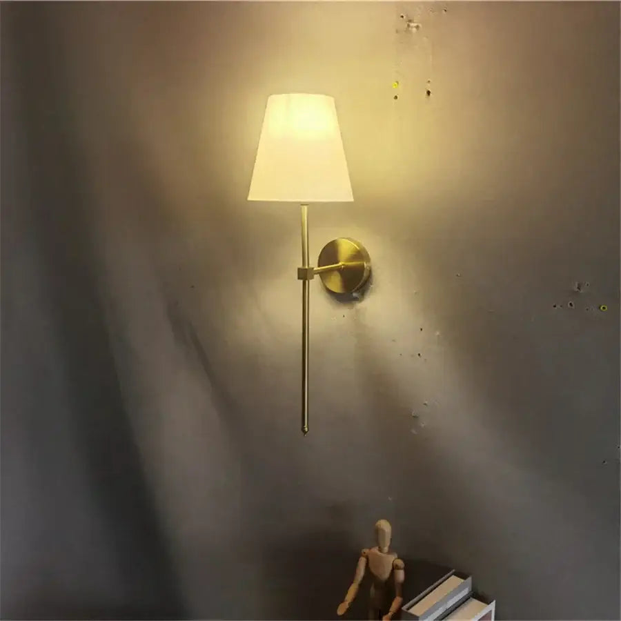 Modern brass led wall sconce with a gold-toned finish and white fabric shade for bedroom decorbites led wall lighting
