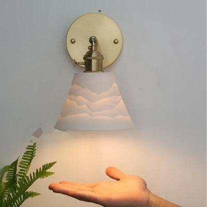 Modern brass mountain led wall lamp sconce with white cloud-patterned glass and brass finish for bedroom or stair lighting