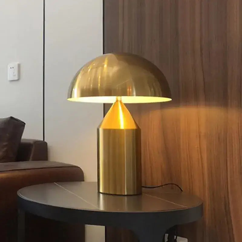 Modern brass mushroom metal led table lamp with a brass dome and warm golden glow for bedroom decorbites atollo metal use