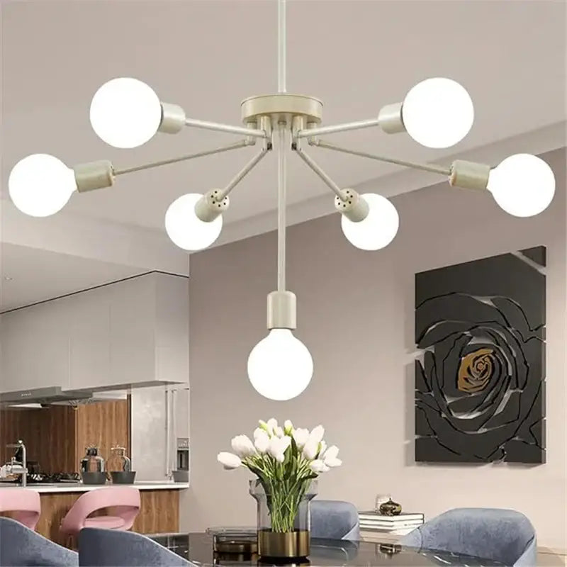 Modern brass nordic ceiling chandelier with white spherical pendant light and minimalist metal frame for living room