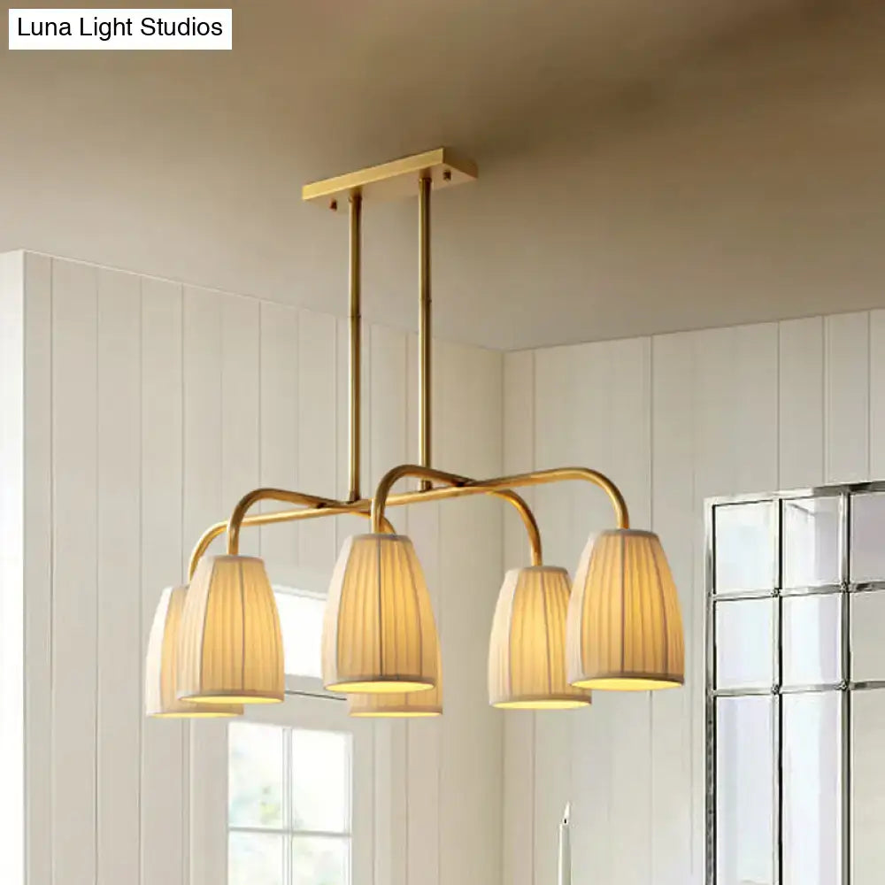 Brass-finished DecorBites rustic pleated fabric pendant chandelier with four warm-toned gold fabric shades for dining table