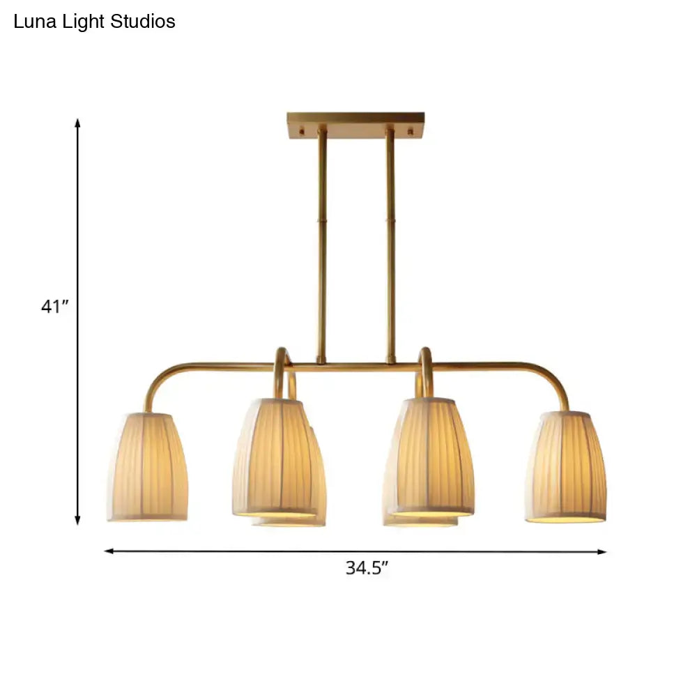 Gold-toned DecorBites rustic pleated fabric pendant chandelier with four warm-lit ribbed fabric shades for dining table lighting