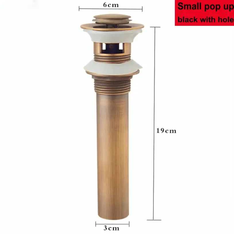 Modern brass pop up drain by decorbites with antique brass finish white ceramic flange and black internal mechanism