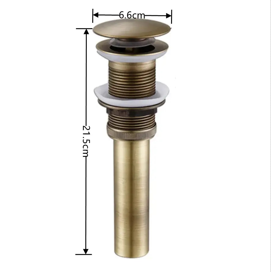 Modern brass pop up drain for bathroom sink in antique brass with fluted threaded body and white ceramic stopper by decorbites brass pop