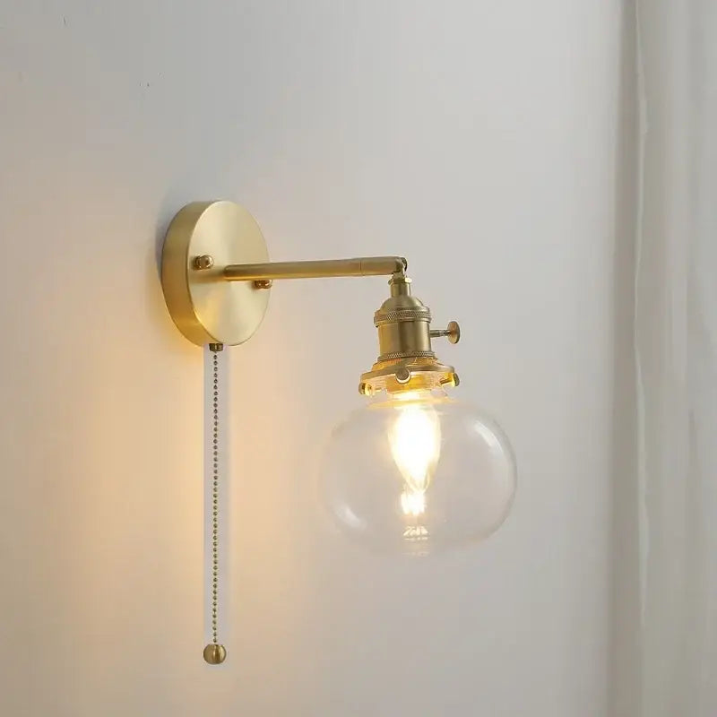 Modern brass ribbed glass ball wall sconce with clear globe and exposed filament bulb for bedroom decorbites glass ball wall