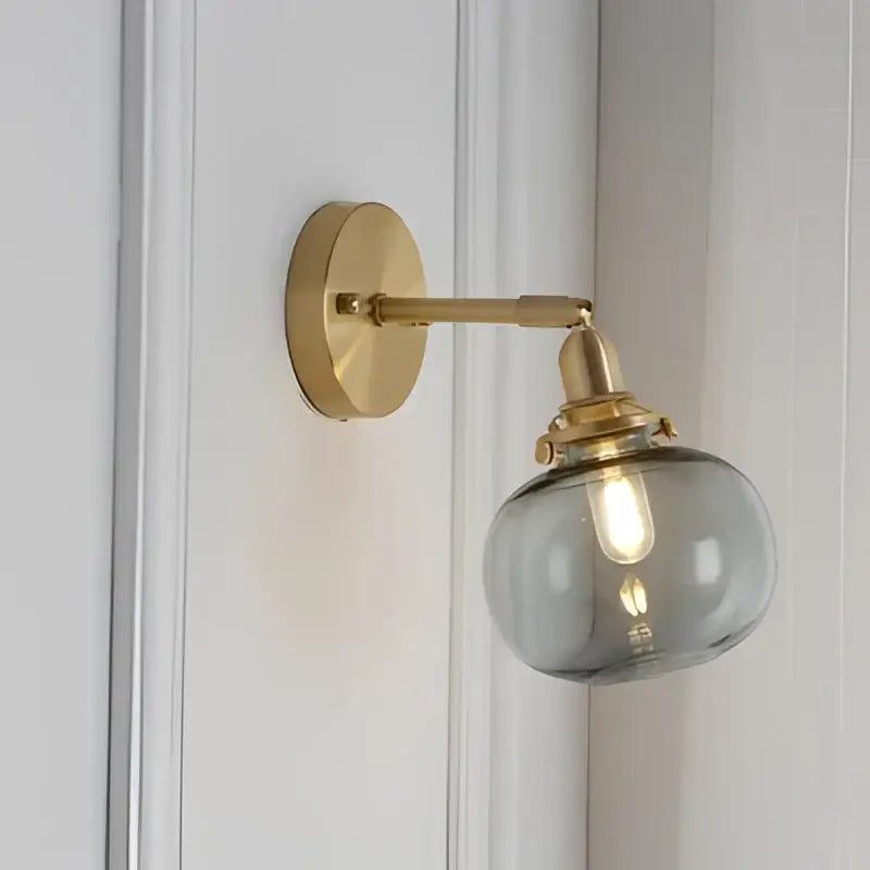 Modern brass ribbed glass ball wall sconce with brass finish and smoked glass globe shade for bedroom decorbites glass ball wall lighting
