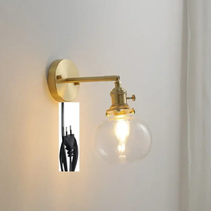 Modern brass ribbed glass ball wall sconce with clear glass globe and exposed filament bulb for bedroom decorbites glass ball