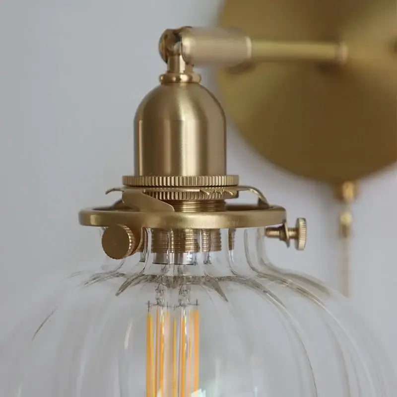 Modern brass ribbed glass ball wall sconce with gold-toned brass and clear ribbed glass for bedroom decorbites glass ball lighting
