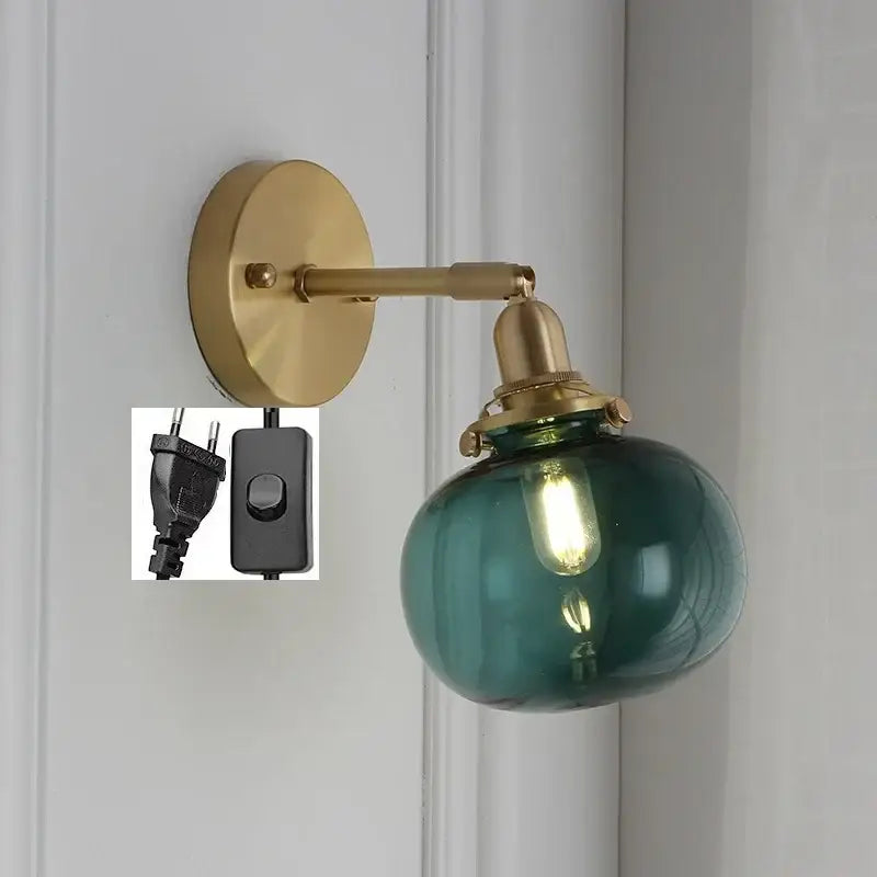 Modern brass ribbed glass ball wall sconce with teal decorbites glass ball and exposed filament bulb for bedroom decor