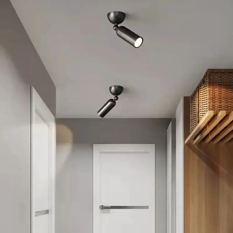 Two sleek matte black adjustable spotlights mounted on ceiling exemplifying decorbites brass rotatable led wall sconces design