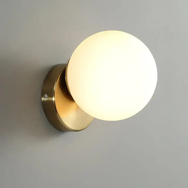 Brass-finished modern round ceiling lamp with frosted glass round globe for hallway lighting