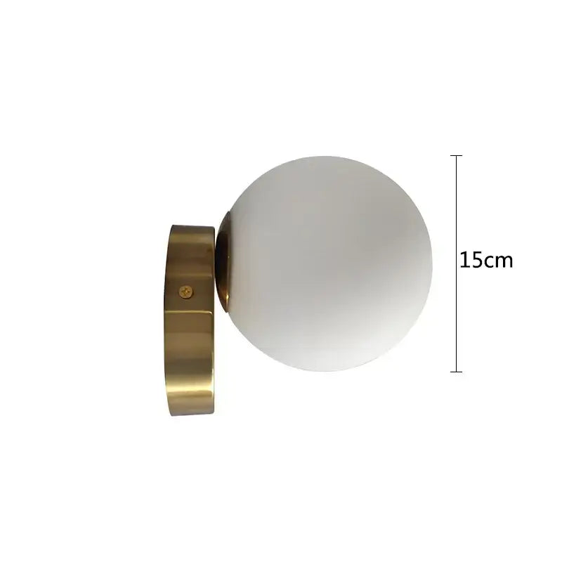 A modern brass round ceiling lamp with a frosted glass round globe for hallway lighting measuring 15cm tall