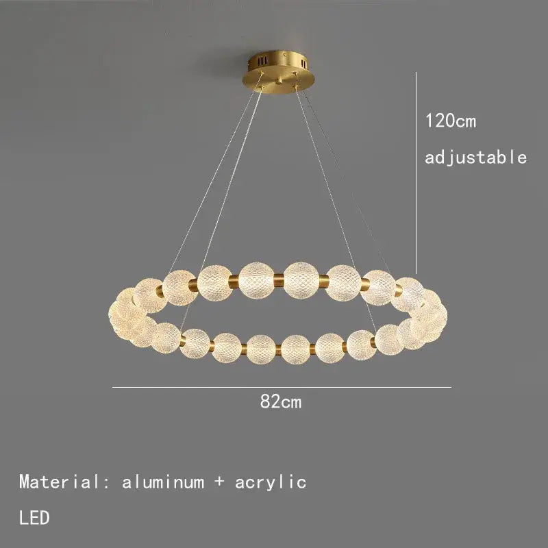 Gold-toned pendant lights featuring brass round led design with textured acrylic spheres and aluminum frame for dining room decorbites brass round chandelier