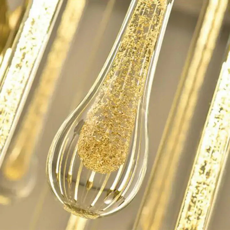 Modern brass round stairs led chandelier with teardrop glass pendant and golden glittery interior for villa dining room decorbites 3w round