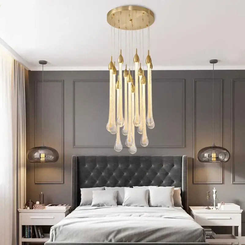 Modern brass round stairs led chandelier with gold-toned circular fixture and teardrop glass pendants for villa dining decorbites 3w round