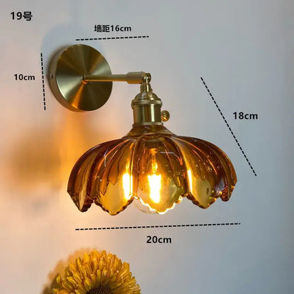 Modern brass wall sconce with amber glass petal-shaped shade decorbites clear glass led bathroom light
