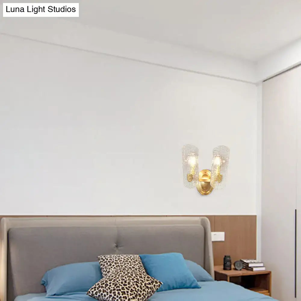 Modern brass sconce with gold tone and two clear water glass shades for living room two lights illumination