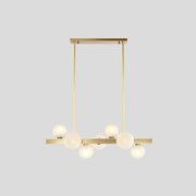 Modern brass simplicity globe pendant dining room light with six frosted glass bulbs in a linear arrangement