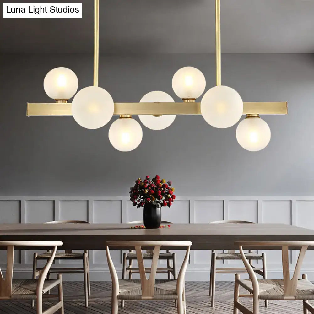 Modern brass spherical glass island ceiling light with frosted glass globe bulb base for kitchen dining