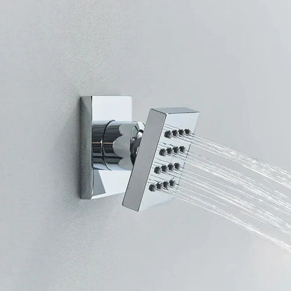 Modern brass square body spray shower jets with chrome-finished nozzles emitting water streams for bathroom massage