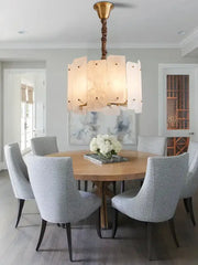 Modern brass stone pendant light with twisted chain and off-white marble panels for dining room decorbites brass stone