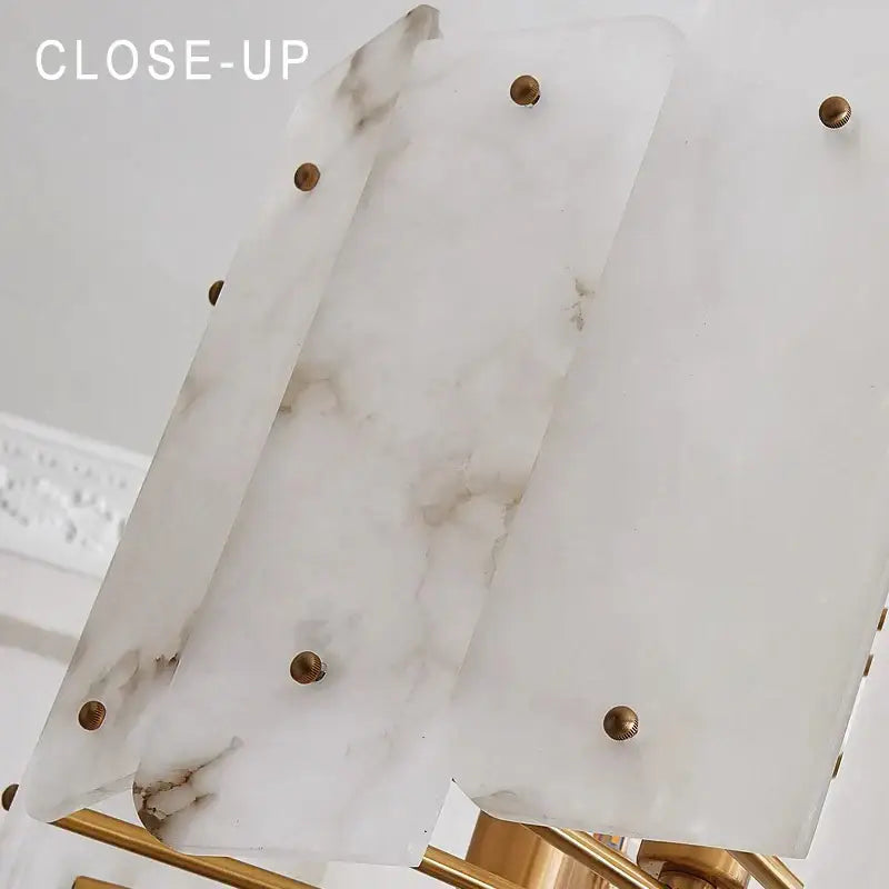 Modern brass stone pendant light with white marble lampshade and gold-toned decorative studs for dining room decorbites brass stone pendant