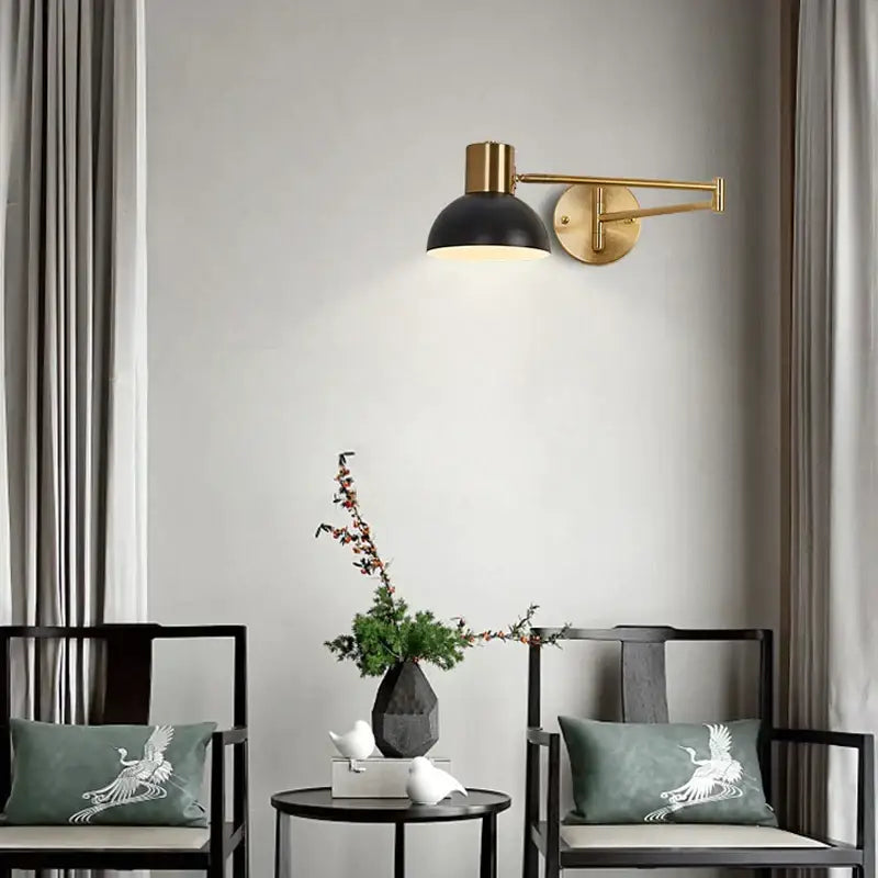 Modern black and brass wall lamp with adjustable swing arm by decorbites ideal for bedroom lighting and decor