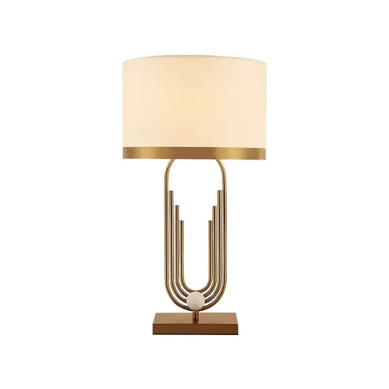 Modern brass table lamp gold paperclip light with cream fabric shade and square base for bedroom decorbites brass table
