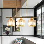 Modern brass triple crystal ceiling pendant light with chain cord length suitable for dining room illumination