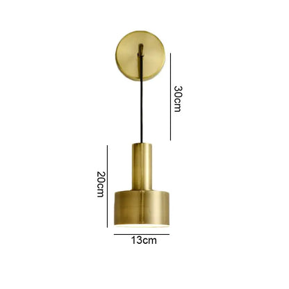 Modern brass wall lamp with cylindrical shade and circular mount for minimalist living room decorbites brass wall lamp