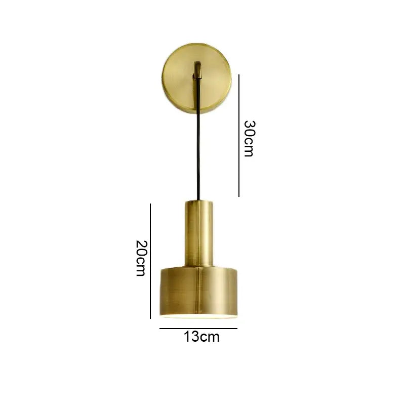 Modern brass wall lamp with cylindrical shade and circular mount for minimalist living room decorbites brass wall lamp