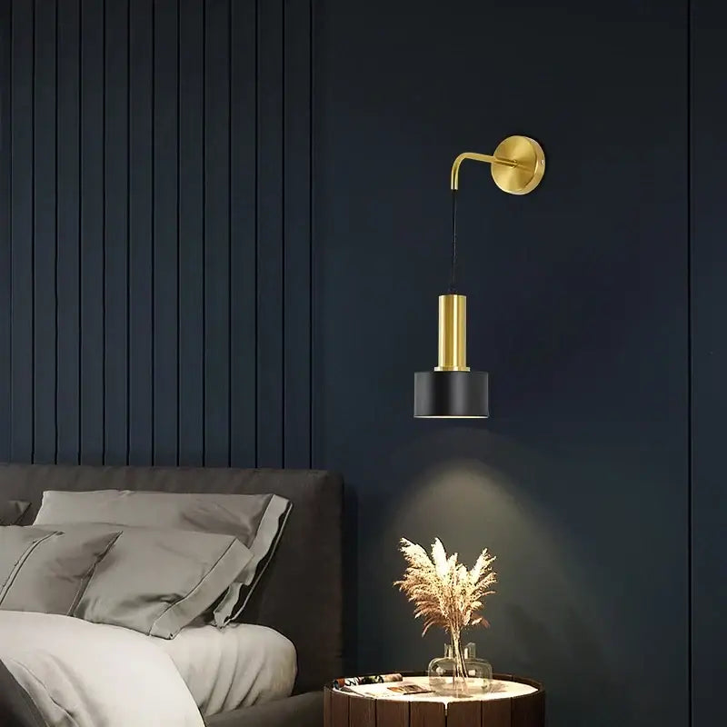 Modern brass wall lamp with gold-toned arm and cylindrical black shade perfect for minimalist living room decorbites brass wall lamp