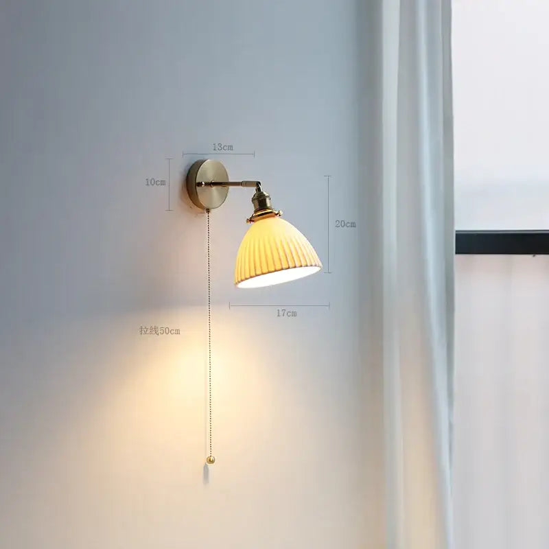 Modern brass wall lamp with ribbed warm yellow glass shade and adjustable pull chain for bedroom reading light decorbites copper arm wall