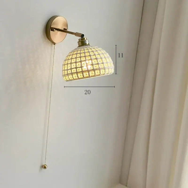 Modern brass wall lamp with warm-toned copper arm and ribbed glass shade for bedroom reading light decorbites copper arm