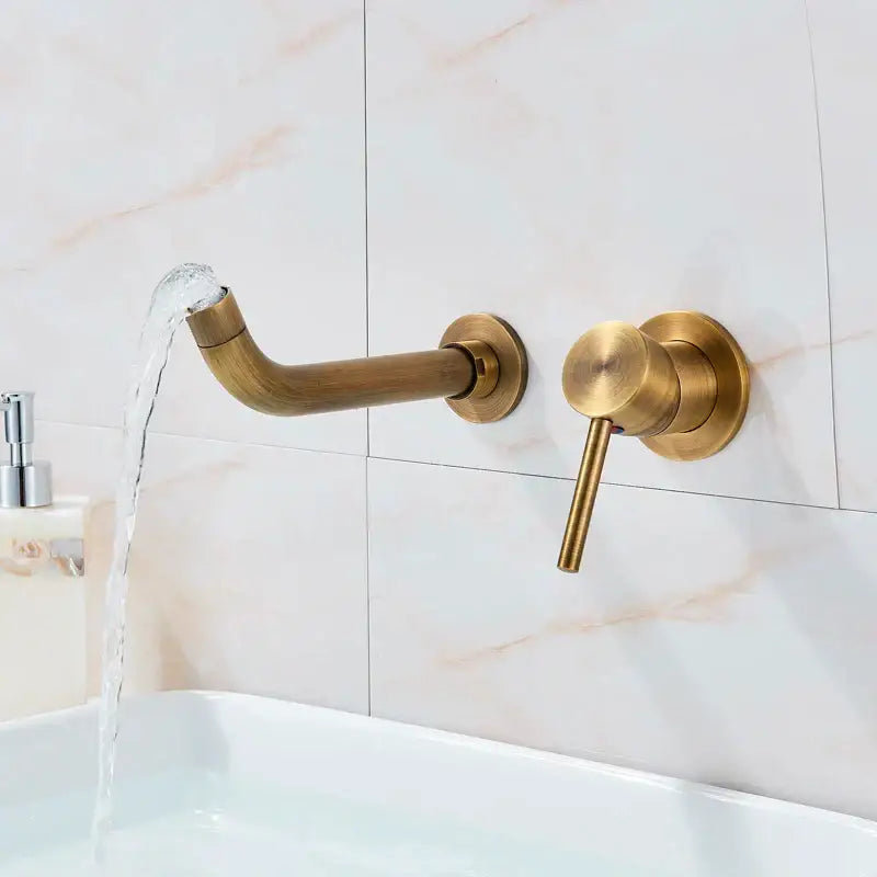 Modern brass wall mount basin faucet with curved spout and cylindrical handle for bathroom use