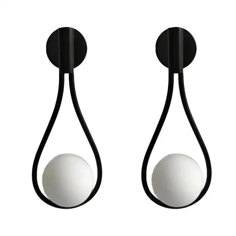 Modern brass wall sconce with black teardrop metal frame and frosted glass bulbs for stylish living room decorbites brass wall sconce