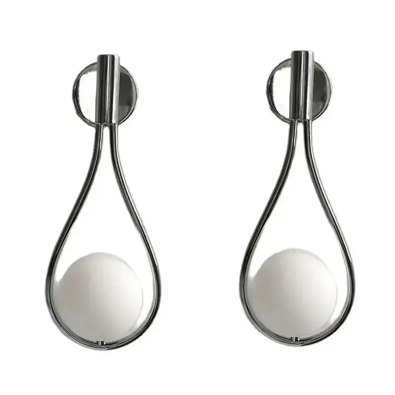 Modern brass wall sconce with frosted glass teardrop globes and polished chrome frame for elegant living room decorbites brass wall sconce