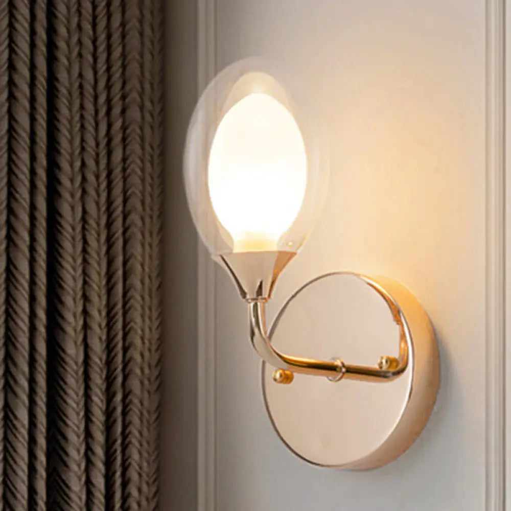 DecorBites™ DecorBites™ Modern Brass Wall Sconce with Clear Glass Shade - Oval Design for Dining Room