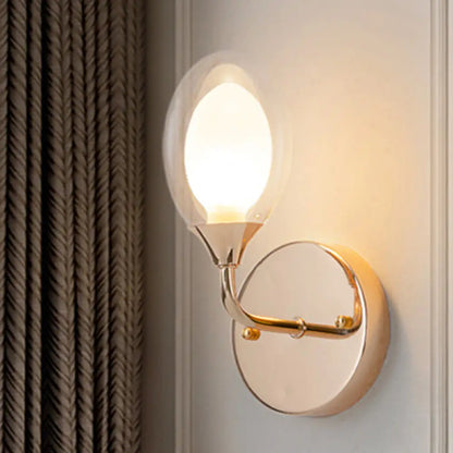 DecorBites™ DecorBites™ Modern Brass Wall Sconce with Clear Glass Shade - Oval Design for Dining Room