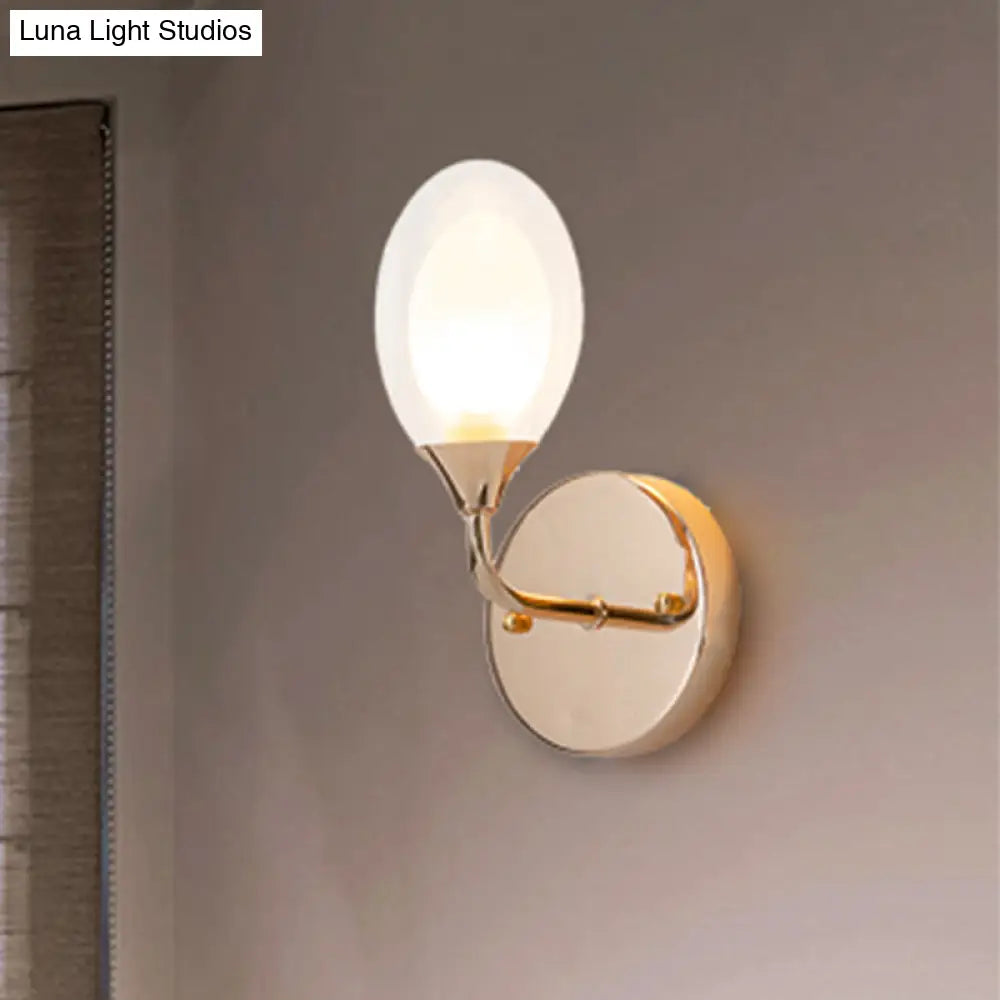 DecorBites™ DecorBites™ Modern Brass Wall Sconce with Clear Glass Shade - Oval Design for Dining Room