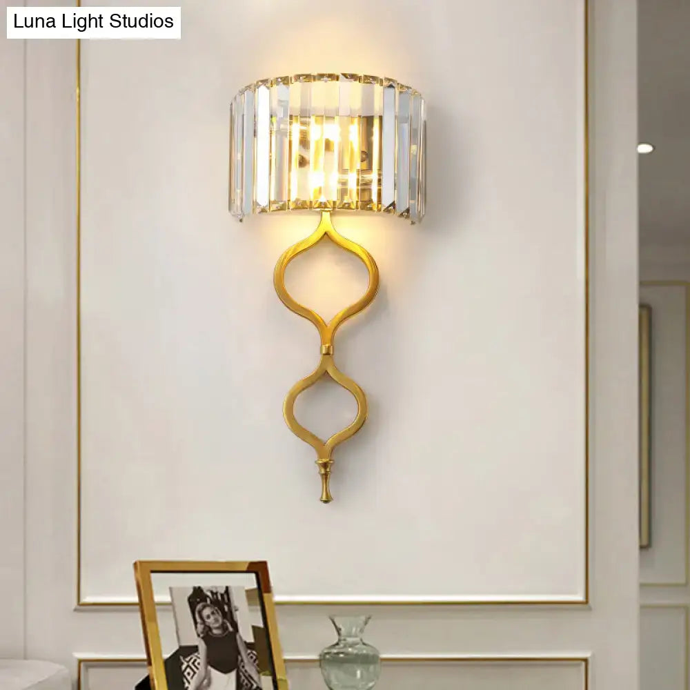 Modern brass wall sconce with gold-toned ornate base and crystal rectangle shade perfect wall mount for bedroom light great choice