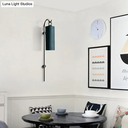 Dark teal cylindrical wall sconce with black metal arm and base direct wired electric 220v-240v for living room use
