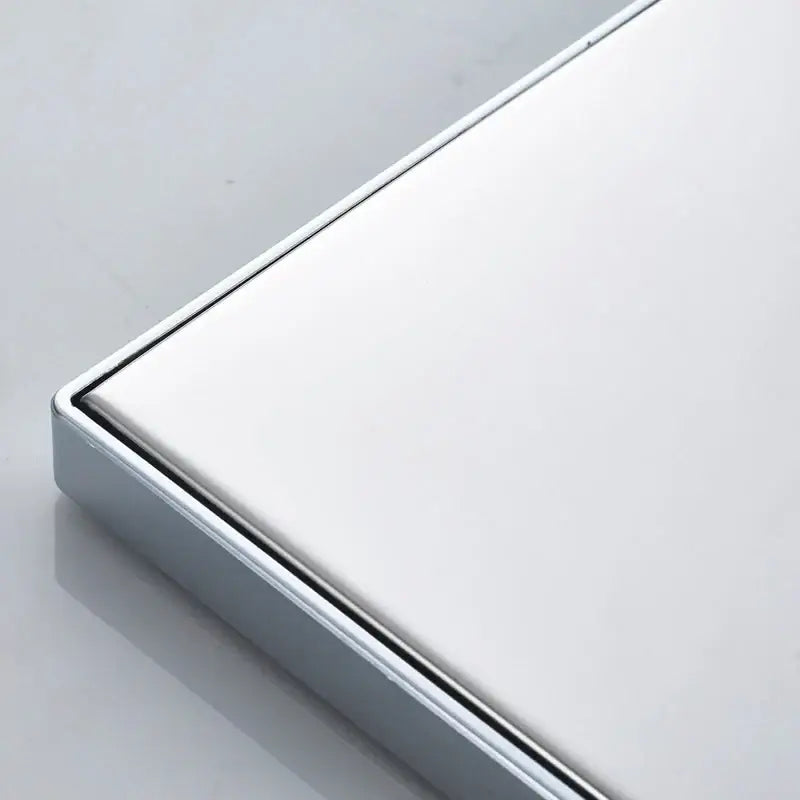 A sleek white shower tray with bright chrome led frame and integrated drainage for decorbites bright chrome shower head