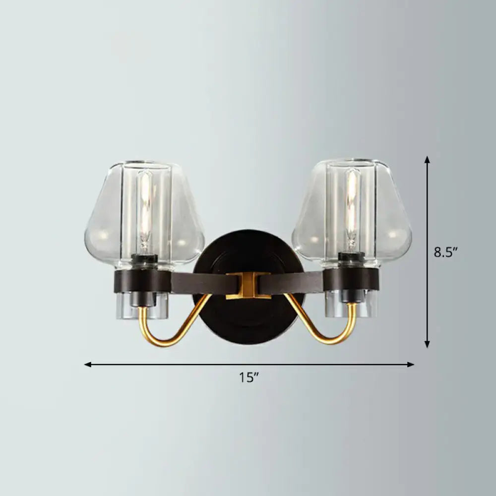 Modern black and gold two-light wall lamp with clear glass shades in bronze brass and smoke gray finish for porch lighting