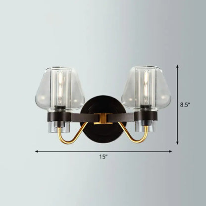 Modern black and gold two-light wall lamp with clear glass shades in bronze brass and smoke gray finish for porch lighting