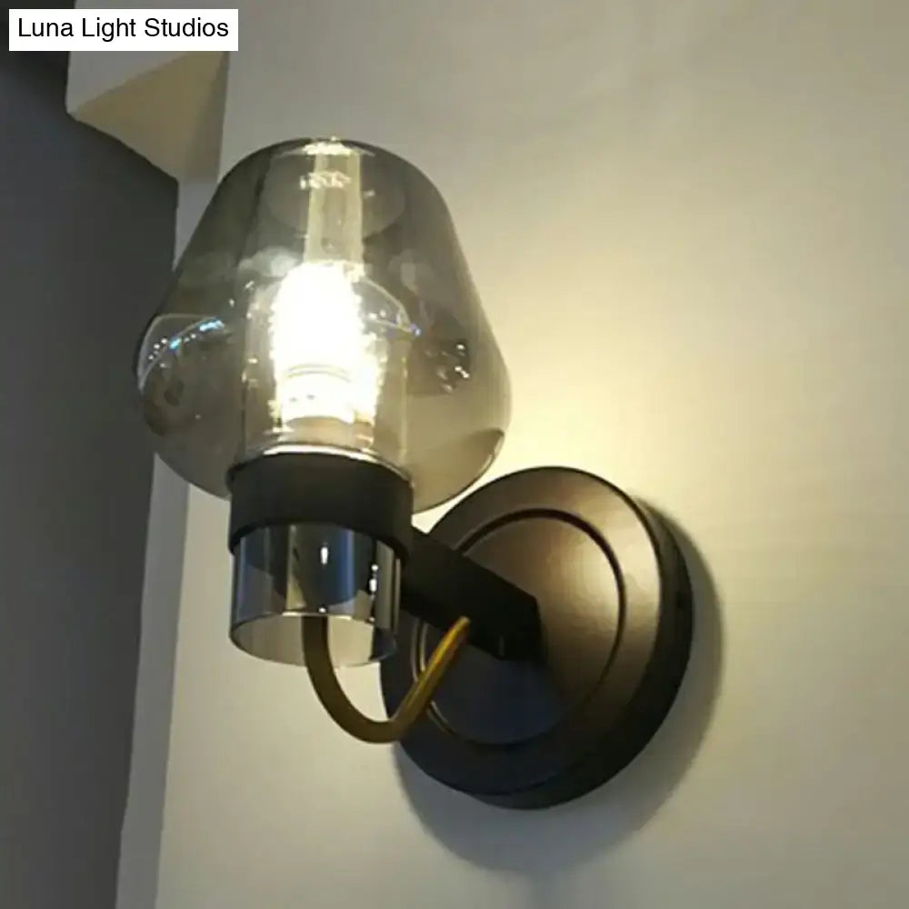 Modern bronze and brass smoke gray wall lamp with smoked glass shade black metal base and polished chrome fittings